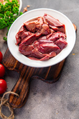 chicken liver fresh raw offal delicious snack mortadella, pistachios, ham healthy meal food snack diet on the table copy space food background rustic top view