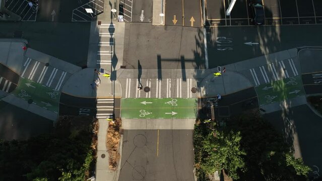 Wide top down view of cyclists commuting on designated bicycle lanes in Seattle.