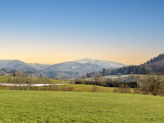 Mountain in Margraves' land (Badenweiler). Blauen or Hochblauen snowy peak as seen from Weitenau im baden-württembergischen district of town Lörrach