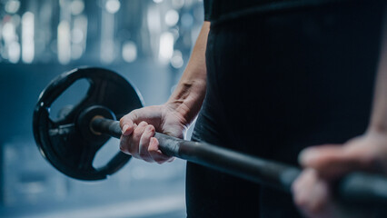 Fototapeta na wymiar Close Up on Female Hands Covered in Chalk, Lifting a Barbell. Professional Resolute Future Female Champion Does Challenging Training and Workout by Performing Weightlifting Exercices