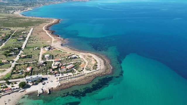 Aerial view of the coast at Custonaci. Beautiful view of the turquoise Mediterranean sea. Sunny day. Sicily. Italy