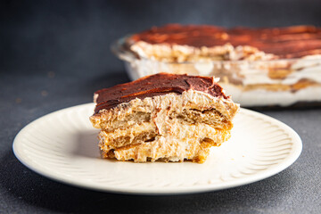 tiramisu dessert savoiardi, mascarpone, amaretto delicious snack mortadella, pistachios, ham healthy meal food snack diet on the table copy space food background rustic top view