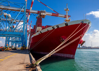 Naklejka premium Shipping containers being unloaded at port facilities in Ashdod, Israel, Containers ships Loading In Ashdod Ports. Israel