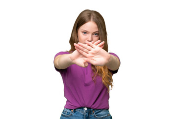 Young pretty woman over isolated background making stop gesture with her hand to stop an act