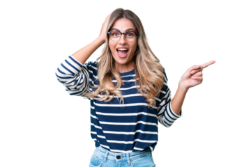 Young Uruguayan woman over isolated background surprised and pointing finger to the side