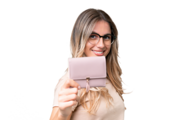 Young Uruguayan woman holding a wallet over isolated background with happy expression