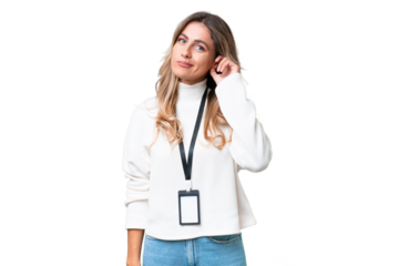 Young Uruguayan woman with ID card over isolated background having doubts