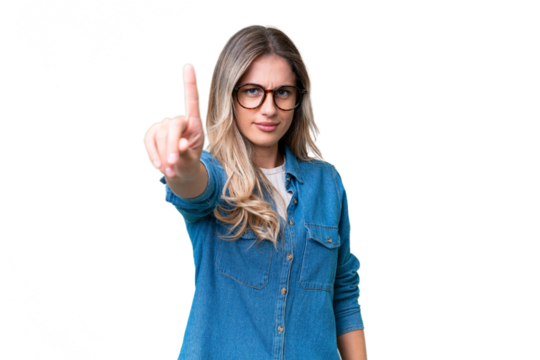 Young Uruguayan woman over isolated background counting one with serious expression