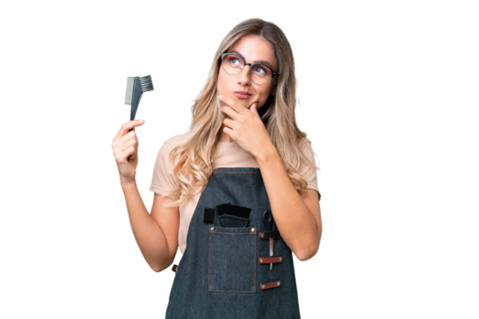 Young Uruguayan hairdresser woman over isolated background having doubts