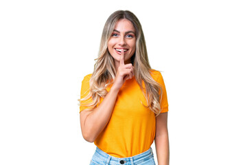 Young Uruguayan woman over isolated background showing a sign of silence gesture putting finger in...