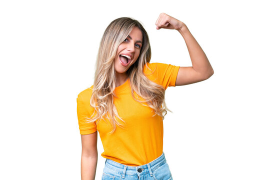 Young Uruguayan woman over isolated background doing strong gesture