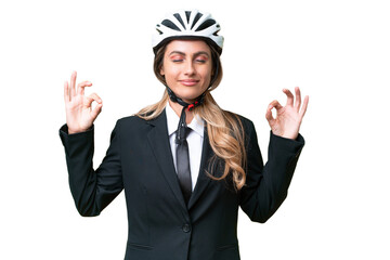 Business Uruguayan woman wearing a helmet biker over isolated background in zen pose