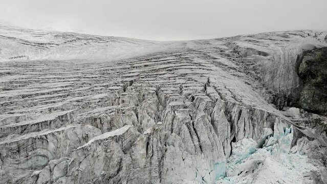 Aerial view of the crevasses of the Moiry glacier near Grimentz in Valais, Switzerland on an overcast day