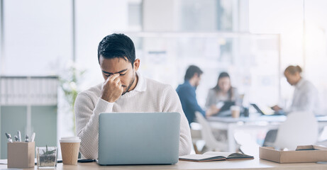 Headache, stress and laptop with a business man at work in his office while suffering from fatigue. Computer, compliance and burnout with a male employee suffering with a bad fail while working