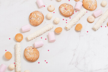 candies and cookies  on white marble background