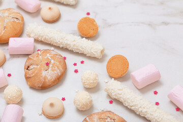 candies and cookies  on white marble background