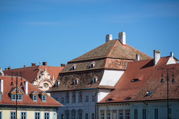 Different roof designs in sibiu town. Vintage eastern european building details. Historical red...
