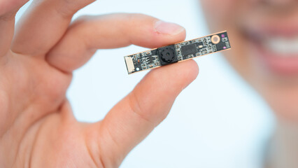 thermal infrared sensor for infrared camera in the hands of a young woman