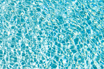 rippled water background blue color in summer swimming pool