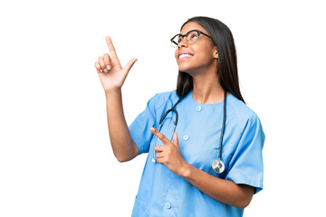 Young African american nurse woman over isolated background pointing with the index finger a great...