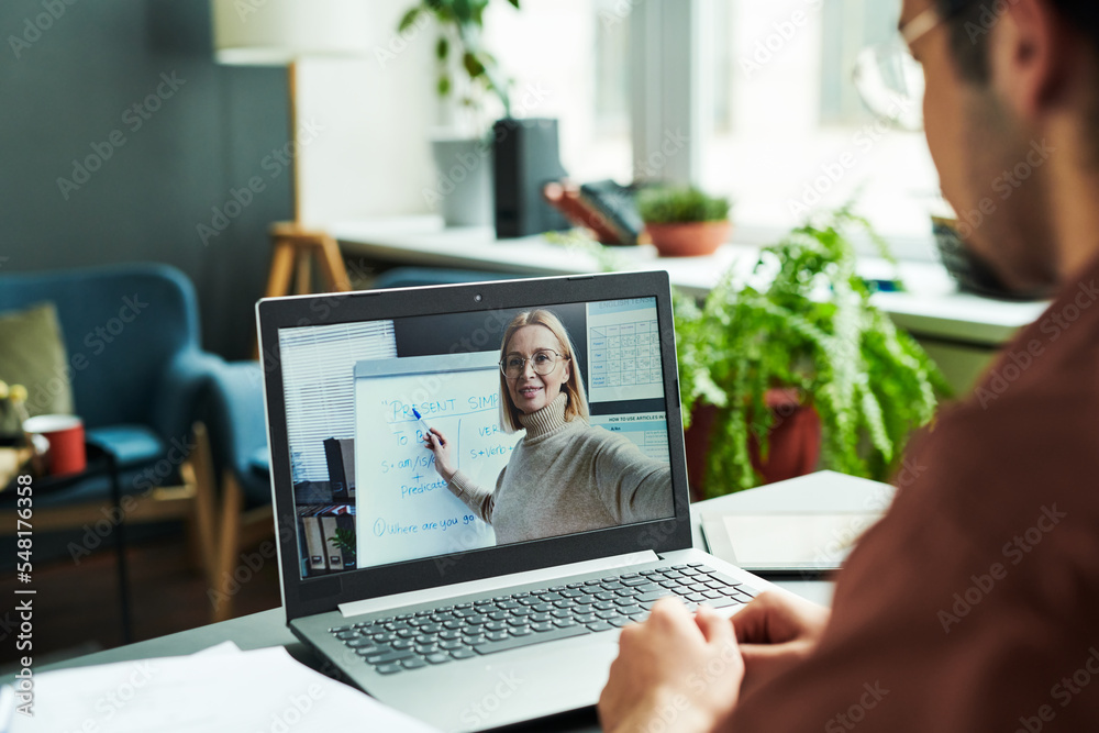 Aufkleber laptop screen with mature blond confident teacher in eyeglasses pointing at whiteboard while explain