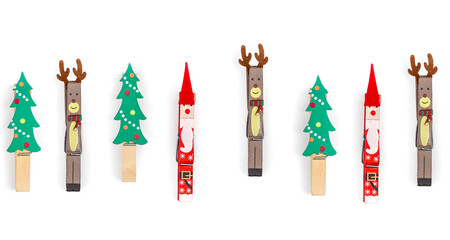 Christmas clothespins on white background isolated, flat lay.