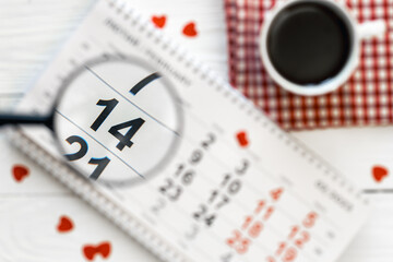 Valentine's Day background, date February 14 on calendar, flat lay, top view.
