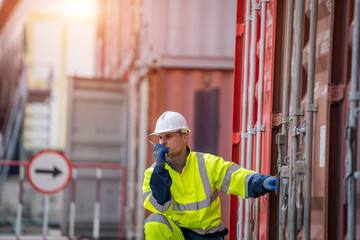 International shipping logistics,Logistics workers of forwarder with tablet inspect cargo at Cargo container shipping.