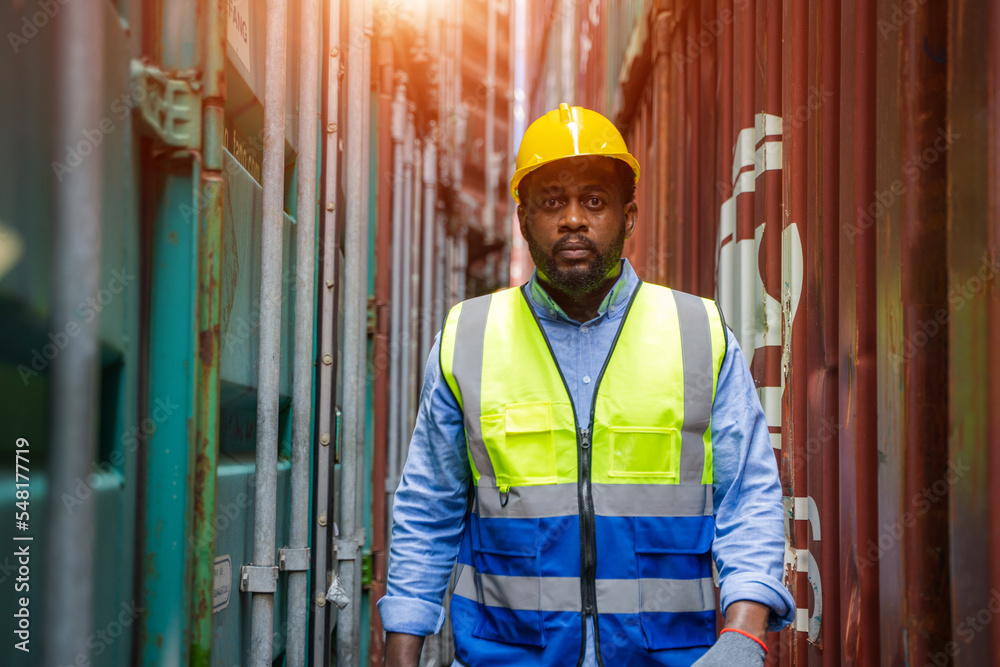 Poster Engineer or foreman checking inventory or job details with cargo container background,Logistic import export working concept.