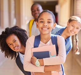 Education, children and portrait of friends at school together standing in the hallway for class. Diversity, backpack and happy students with a smile playing in the corridor of the campus with books.