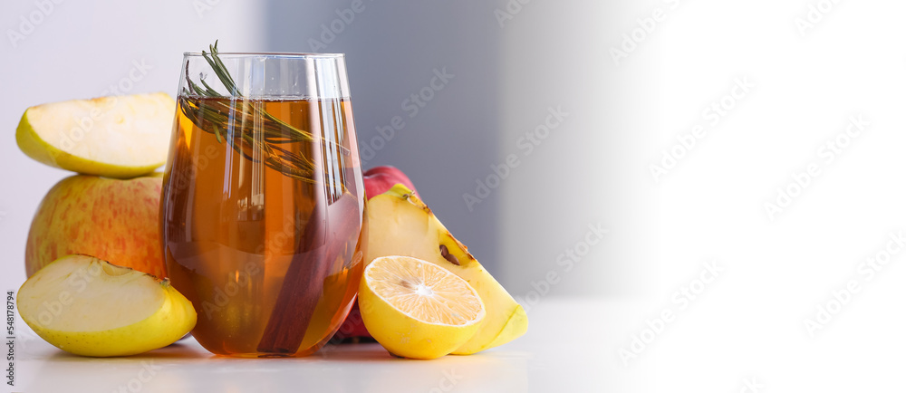 Canvas Prints glass of fresh apple juice on light background with space for text