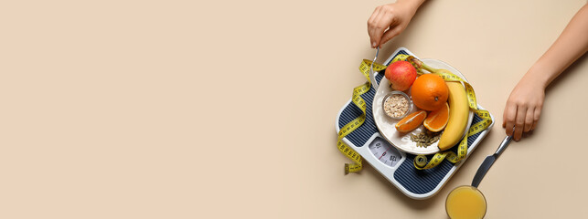 Female hands, plate of fresh products, scales and measuring tape on beige background with space for text. Diet concept