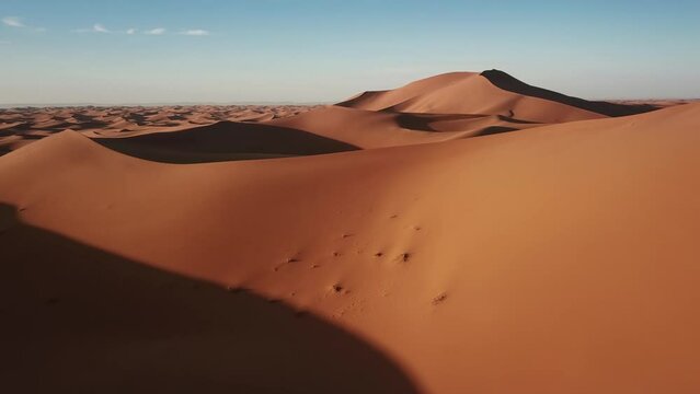Aerial view on sand dunes in Sahara desert at sunrise, Africa