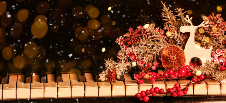Beautiful Christmas decor on piano keys, closeup