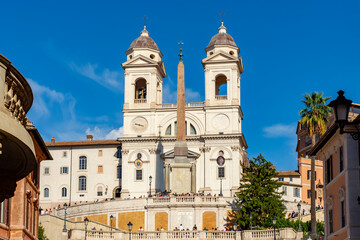 Fototapeta na wymiar Spanish steps and Trinita dei Monti church in Rome, Italy