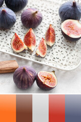 Tray with fresh figs on light background. Different color patterns