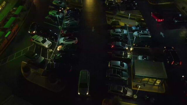 Austin Texas at night. Flying over cars in a parking lot with a low lighting setting. The cinematic feel of the video is great for a short film.