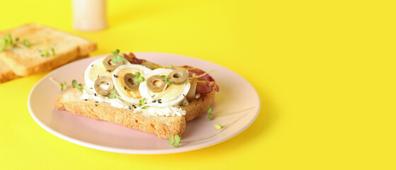 Plate with tasty toast on yellow background with space for text