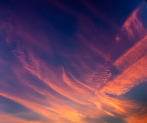Clouds in the sky illuminated by the setting sun in summer