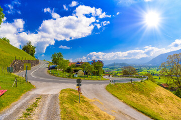 Naklejka premium Curved road in Alps village, Grabs, Werdenberg, St. Gallen, Swit
