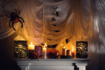 Obraz premium Different Halloween decor on fireplace indoors. Festive interior