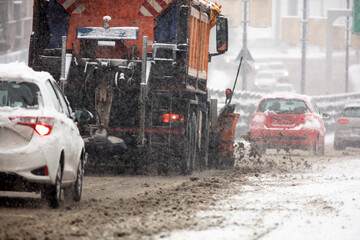 Fototapeta na wymiar Snow plow truck cleaning streets from heavy snowfall.