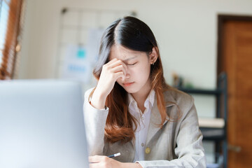 Portrait of sme business owner, man using computer and financial statements Anxious expression on expanding the market to increase the ability to invest in business