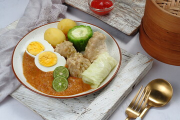 Siomay or Somai,Indonesian steamed fish dumpling with vegetables served in peanut sauce.