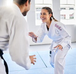 Karate, fitness and teacher with student, combat sports and training for skill development, power and discipline in dojo gym. Fight, happy in taekwondo class and martial arts with sport exercise.