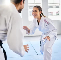 Gordijnen Karate, fitness and teacher with student, combat sports and training for skill development, power and discipline in dojo gym. Fight, happy in taekwondo class and martial arts with sport exercise. © Irshaad M/peopleimages.com