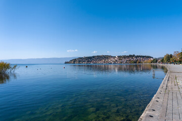 Fototapeta na wymiar landscape view of Lake Ohrid and the waterfront with the castle on the hilltop