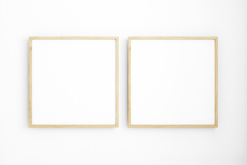 Two frame mockup on white wall