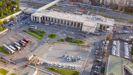 Aerial view of Roma Ostiense, a railway station in Rome, Italy. The entire facade is made of Travertine marble and the entrance is marked by a columned portico.