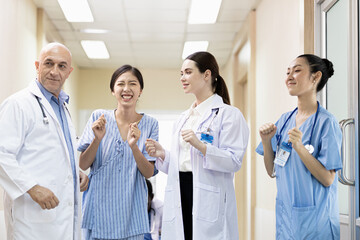 Fototapeta premium team of doctors, nurses, medical students dancing to express the joy of being healed